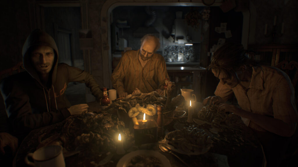 Cena do jogo Resident Evil 7: biohazard. Perspectiva em primeira pessoa: Ethan observa op jantar da família Baker numa mesa circular. À sua esquerda, Lucas, um homem caucasiano careca usando um moletom azul escuro com o capuz levantado e uma sigla amarela no peito, virado para Ethan, com a mão direita apoiada na mesa. Na frente de Ethan, Jack, um homem caucasiano de meia idade com o cabelo começando a cair e uma barba grisalha, usando óculos e uma camisa amarela listrada. Por fim, à direita de Ethan, Marguerite, uma mulher caucasiana usando uma camisa de mangas curtas concentrada em sua comida. Acima da mesa, iluminada por três velas, vemos uma sorte de alimentos apodrecidos e de aparência crua, tripas e outros órgãos humanos. Atrás da família há uma cozinha, iluminada por uma luz branca vinda de uma lâmpada fluorescente acima da pia, com uma bancada separando-a da sala de jantar.