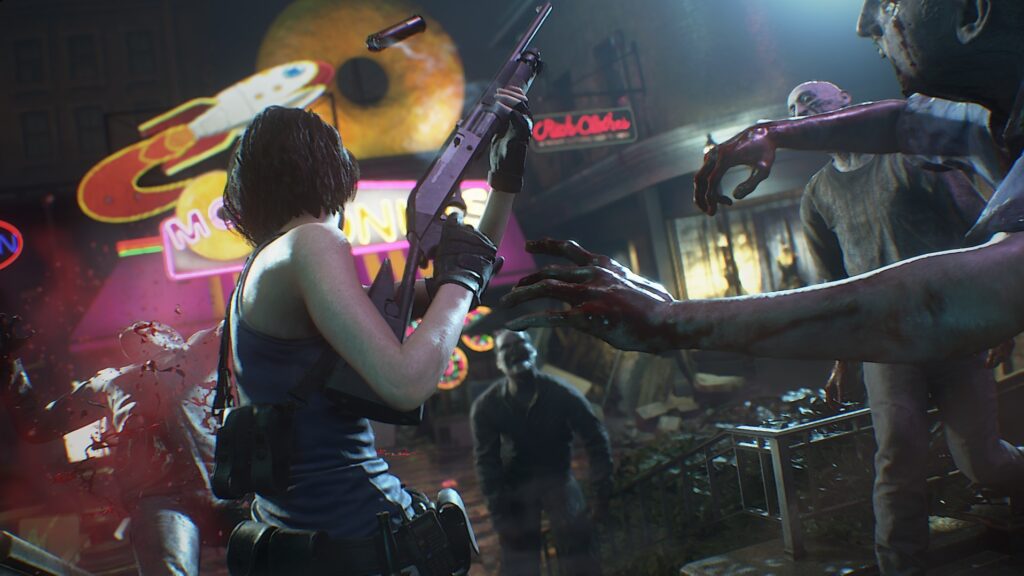 Cena do jogo Resident Evil 3: Cercada por mortos-vivos, Jill Valentine dispara sua espingarda na frente de uma loja de donuts. JIll é uma mulher caucasiana de cabelos castanhos, usando uma camiseta regata azul e calças pretas com vários bolsos em seu cinto. No seu ombro vemos um coldre preto com alguns bolsos e alguns bolsos. Ela está com a arma erguida para cima e podemos ver o cartucho disparado sendo ejetado acima de sua cabeça. Do lado esquerdo, um dos zumbis é alvejado, sendo jogado para trás com uma névoa de sangue em sua frente. À direita de Jill, mais dois se aproximam, com os braços erguidos para agarrá-la. Na frente de Jill, outro zumbi se aproxima. Todos eles tem pele acinzentada, coberta por manchas de sangue, olhos brancos e pouco cabelo. Na frente de Jill vemos uma escada que desce e dá para um restaurante com um donut gigante e amarelo no telhado. Do lado direito da loja há outro edifício com as luzes acesas e cortinas fechadas. A loja de donuts é decorada com vários sinais neon coloridos, contrastando com a noite ao redor.